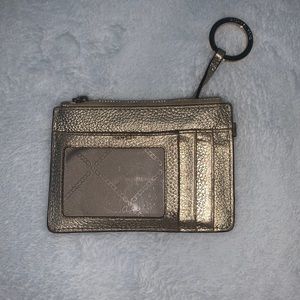 Micheal Kors coin purse has three card slots and a zip pouch for keys and change